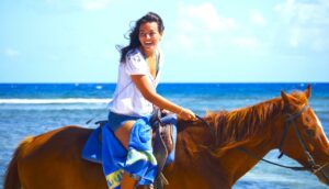 Girl riding horseback tour